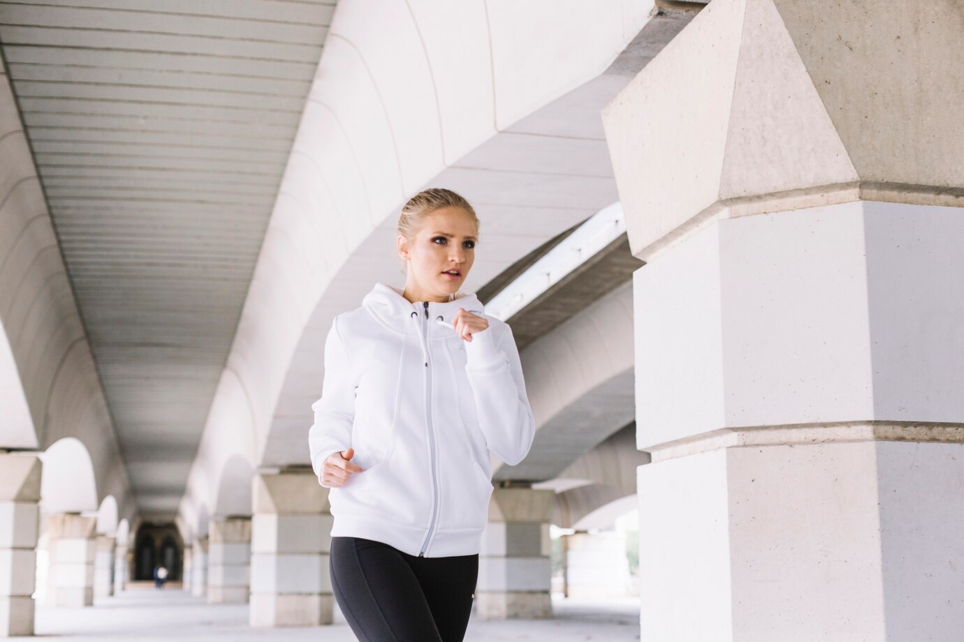 pretty-woman-running-near-pillars_23-2147800928